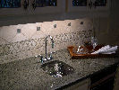 Verde Tunis - Hammered Stainless Sink - Tile Backsplash